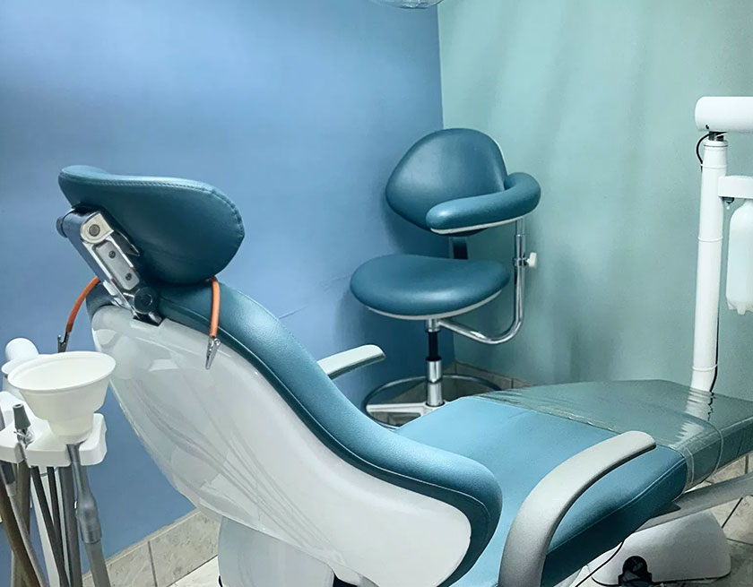 An image of a dental chair setup in a professional dental office.
